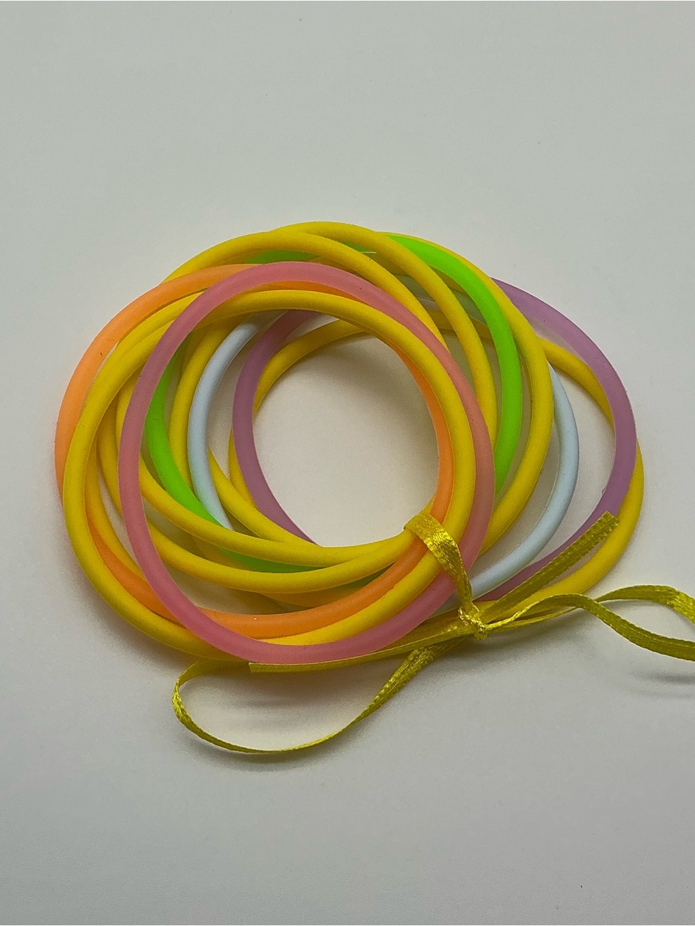Set of 12 Yellow and Pastel Rainbow Colored Jelly Bracelets
